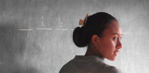 Woman standing at blackboard Woman standing at blackboard